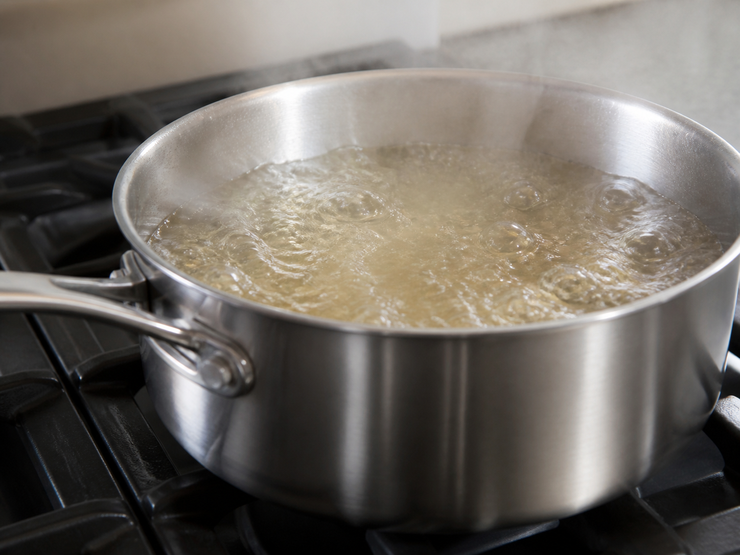 Liquid at a rolling boil with large continuous bubbles